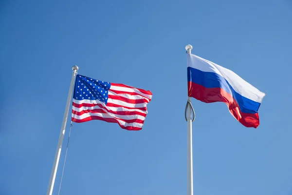 Russian Federation Usa Windy Flags Blue Cloudless Sky Background — Stock Photo, Image