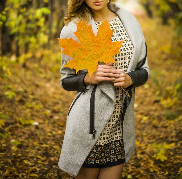 woman with big maple leaf