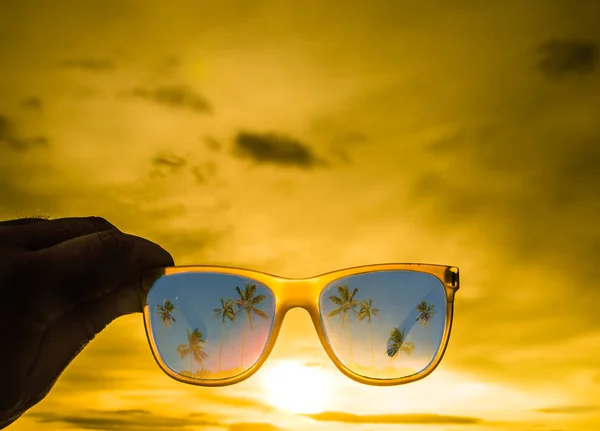 Sunglasses  with palm trees reflection — Stock Photo, Image