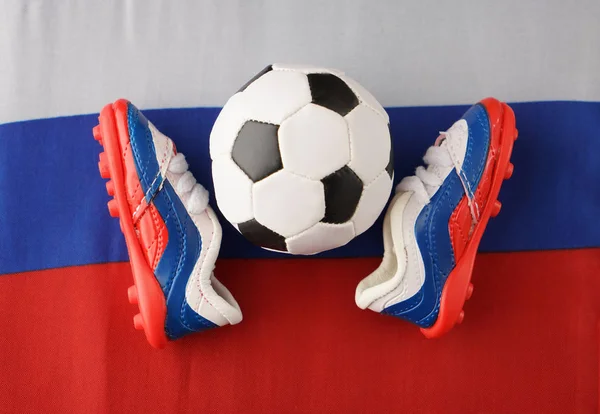 Bola e botas com tricolor — Fotografia de Stock