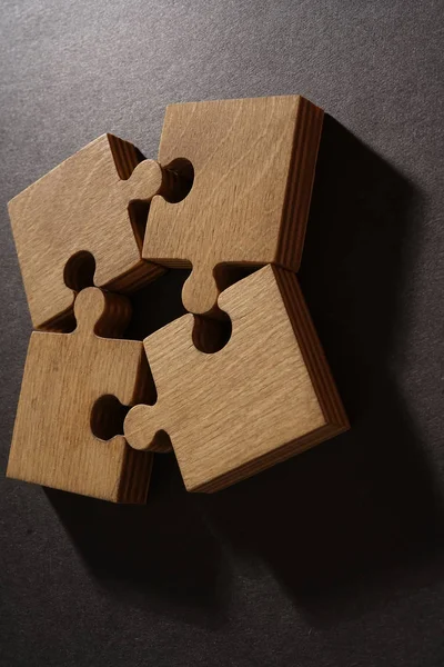 Four brown pieces of puzzle — Stock Photo, Image