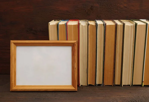 books on brown wooden bookshelf