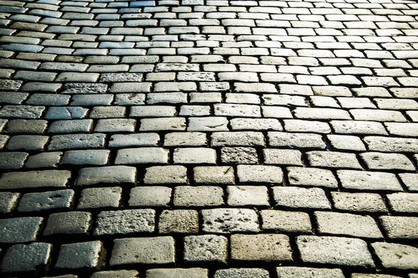 丸石背景、舗装道路 — ストック写真