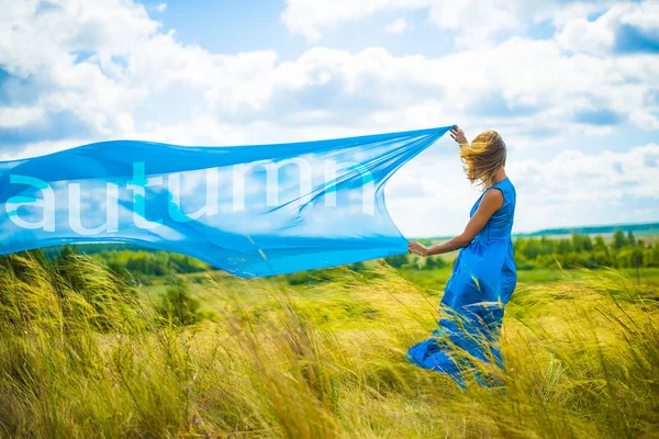 Girl with flying blue cloth — Stock Photo, Image