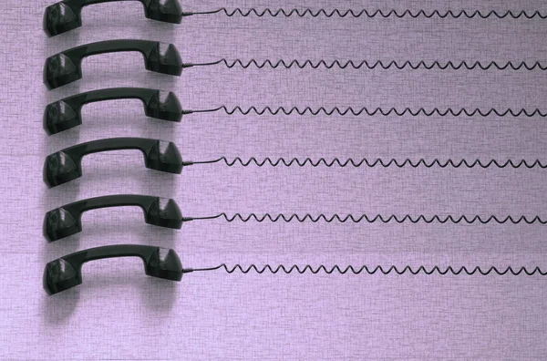 Black plastic telephones hanging by cords on purple background