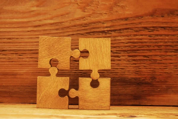 Wooden puzzle pieces — Stock Photo, Image