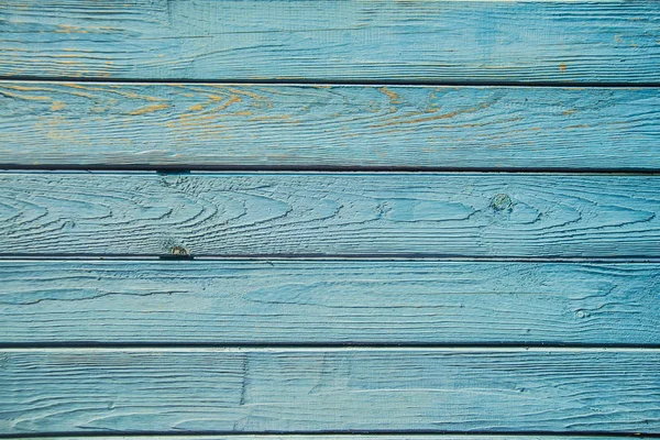 Oude geschilderde blauwe houten hek — Stockfoto