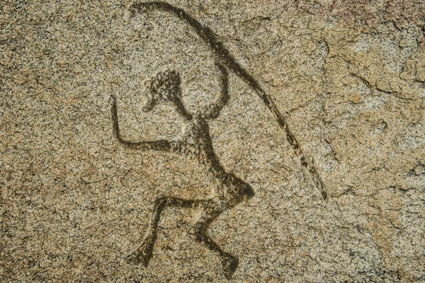 Uomo primitivo con un bastone — Foto Stock