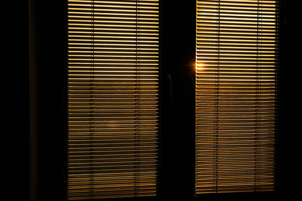 Sunlight behind vertical blinds. — Stock Photo, Image