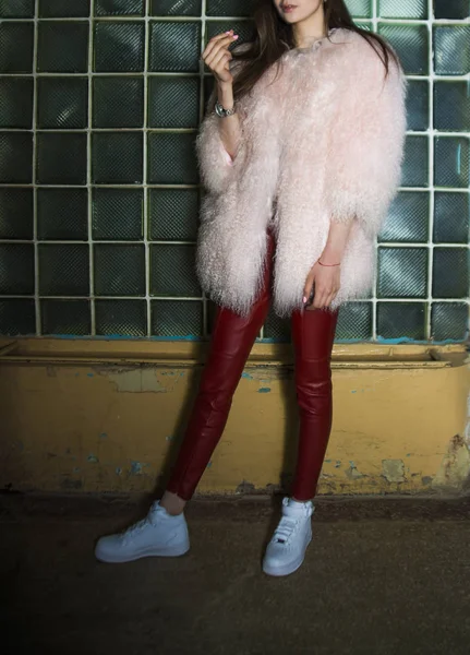 woman in  pink fur coat