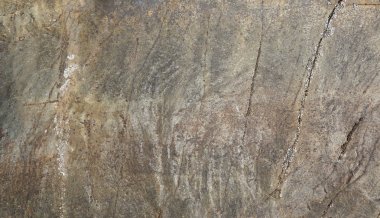 Kahverengi renk tonu ile Mermer yüzey. Taş dokusu
