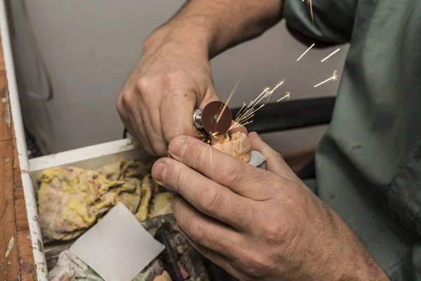 technician making the artificial teeth