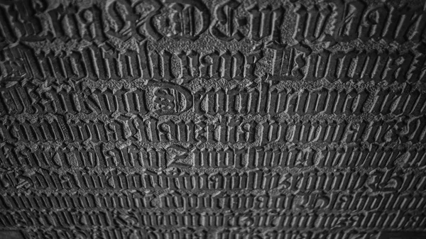 Latin letters in a grave stone — Stock Photo, Image