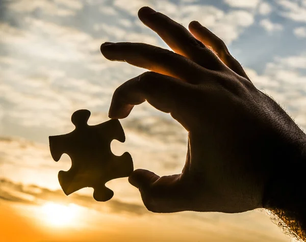 Hand  with puzzle piece — Stock Photo, Image