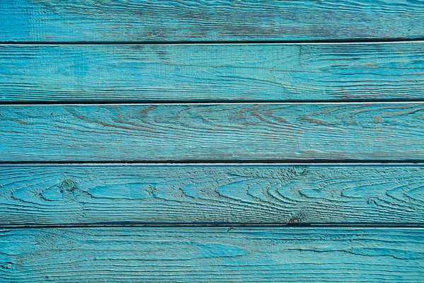 Oude geschilderde blauwe houten hek — Stockfoto