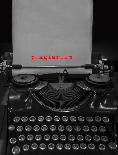 plagiarism, Copyright printed on an old typewriter. Black retro vintage aged typewriter with word on  white blank paper sheet