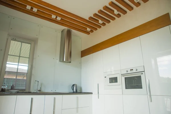 interior background. Clean white kitchen . kitchen interior with furniture and cooking utensils.