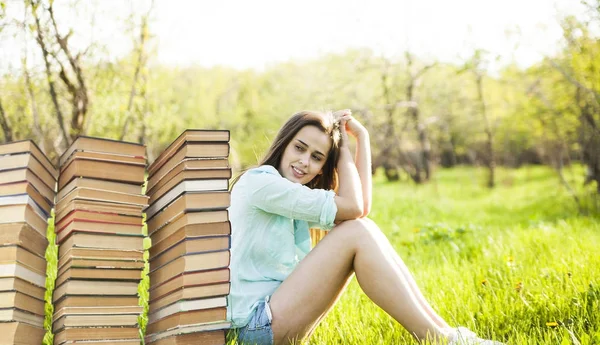 Young Woman Sitting Book Stacks Green Grass Field Background — Stock Photo, Image