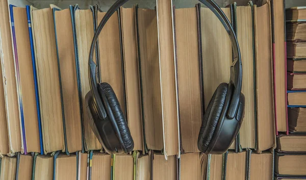 Books and headphones as audio books concept