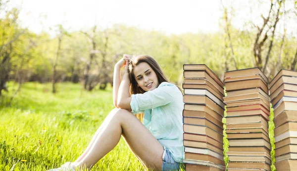 Young Woman Sitting Book Stacks Green Grass Field Background — Stock Photo, Image
