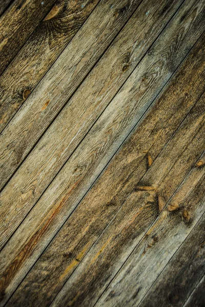 background of brown  wooden  flooring with boards. Wooden decking planks close up.