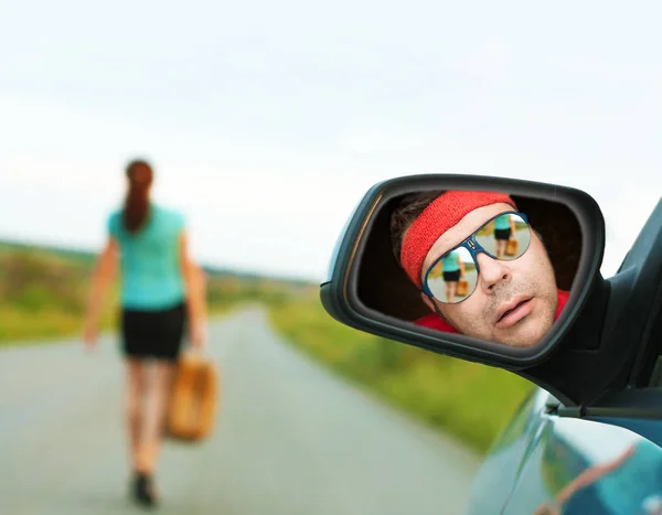 man meeting sexual woman. rearview mirror reflection.  Safe summer or spring trip, journey driving concept
