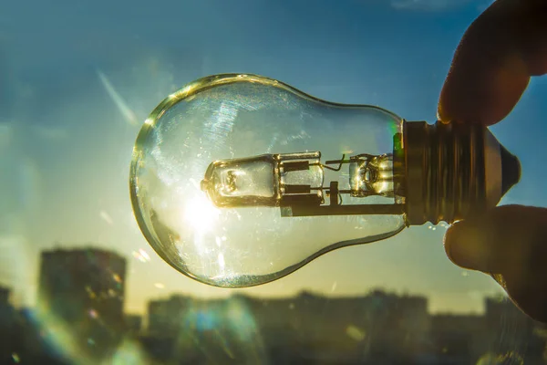 Hand Holding Light Bulb Sunset Background — Stock Photo, Image