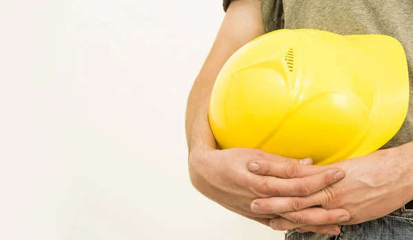 Construction Worker Holding Yellow Plastic Helmet Isolated White Background — Stock Photo, Image