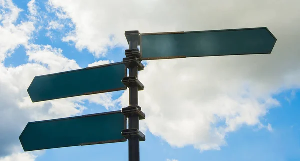 Blank Road Signs Blurry Blue Sky White Clouds Foundation — стоковое фото