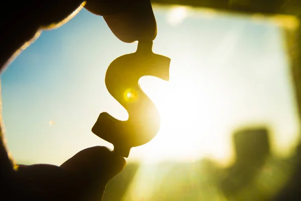 Hand Holds Silhouette Dollar Sign Sunset Sky Background — Stock Photo, Image