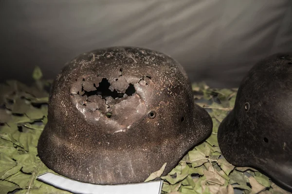 rusty  World War II military helmets