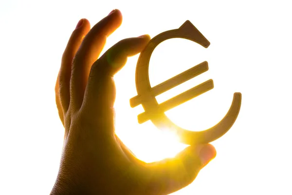 Mão Homem Segurando Euro Silhueta Ícone Contra Pôr Sol — Fotografia de Stock