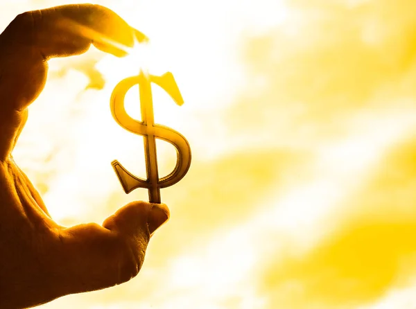 Handen Håller Silhuetten Dollartecknet Sunset Bakgrund — Stockfoto