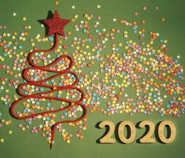 Sigh symbol Christmas Tree from a lot colorful confetti, lace and candy star toy 