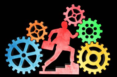 işadamı birçok dişli tekerlekleri, beyaz arka plan üzerinde izole cogwheels içinde çalışan durumda. 