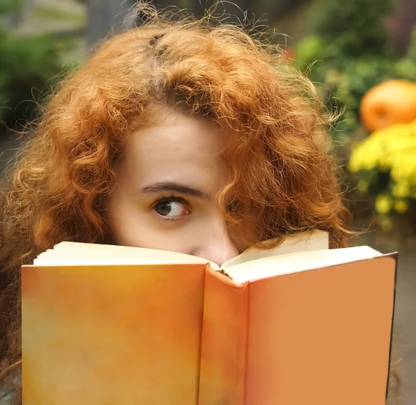 Beautiful Curly Redhead Student Girl Covering Her Face Orange Book — Stock Photo, Image