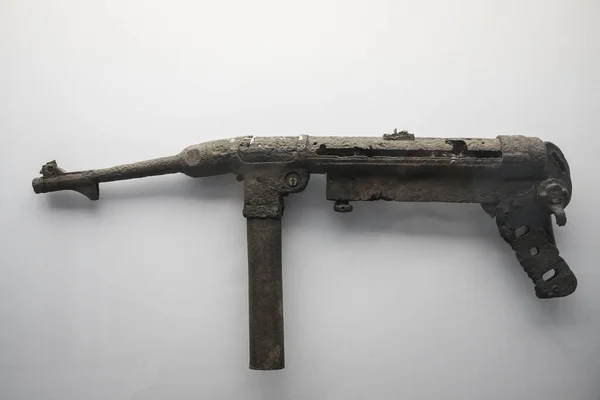 mp40 german machine gun hand isolated on a white background. machine gun manual  during the Second World War. rusty machine gun and bent gun barrel