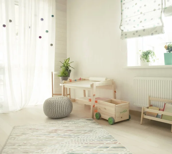 children's room and furniture and natural green flowers