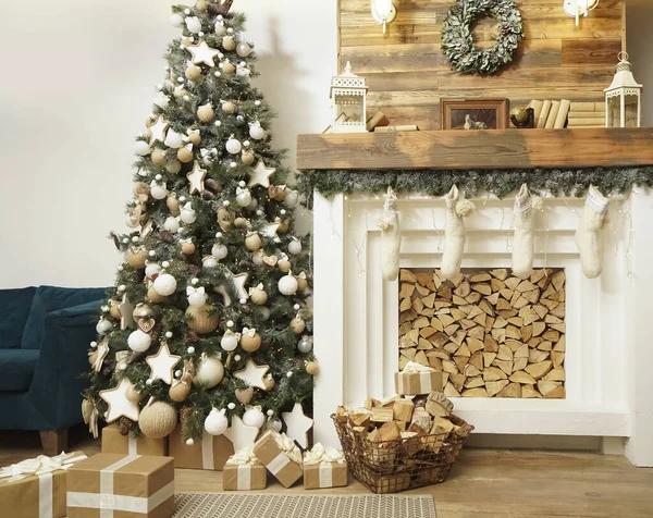 Design room with Christmas tree, sofa and the fireplace. Interior eco style. Christmas decorated interior of couch and Christmas tree, modern and cozy. happy new year and merry christmas