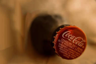 MOSCOW, RUSSIA - NOVEMBER 26, 2016 : Coca cola drinking in paper sack  background. natural brown Bag for fast food