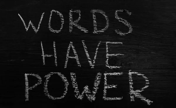 Words have Power on brown wooden Board background. empty copy space for inscription.