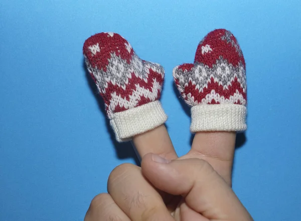 Two Fingers Male Hand Knitted Red White Mittens Isolated Blue — Stock Photo, Image