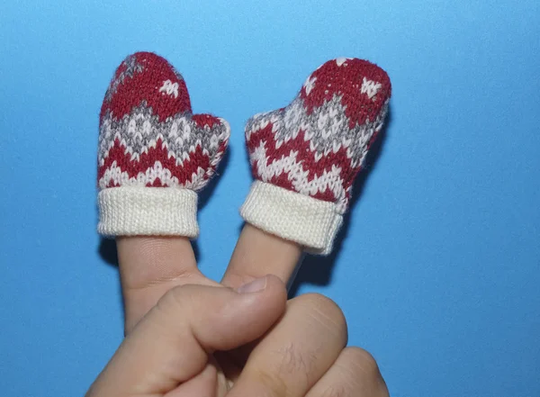 Two Fingers Male Hand Knitted Red White Mittens Isolated Blue — Stock Photo, Image