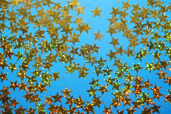 Golden Yellow Stars Glitter Lie Isolated Blue Background Festive Holiday — Stok fotoğraf