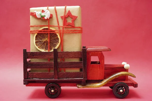 Wooden Toy Truck Christmas Gift Box Red Paper Background Copy — Stock Photo, Image