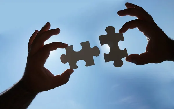Hands Puzzle Pieces Sky Background Stock Picture