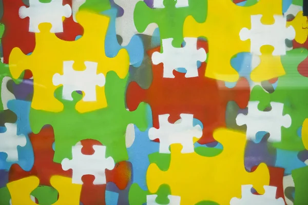 business background of colorful puzzle pieces. Children playtime. Toys and games. wall surface.  backdrop with puzzle elements.
