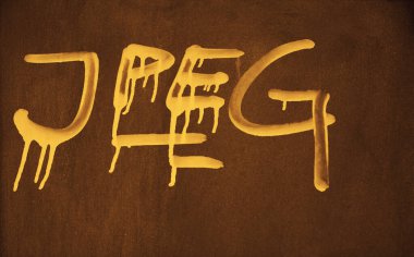 Paslı metal duvara yazılmış Jpeg kelimesi. resim, fotoğraf biçimi