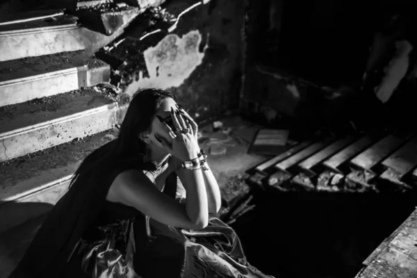 Woman Holding Hands Face While Sitting Dark Stone Staircase Deep — 스톡 사진