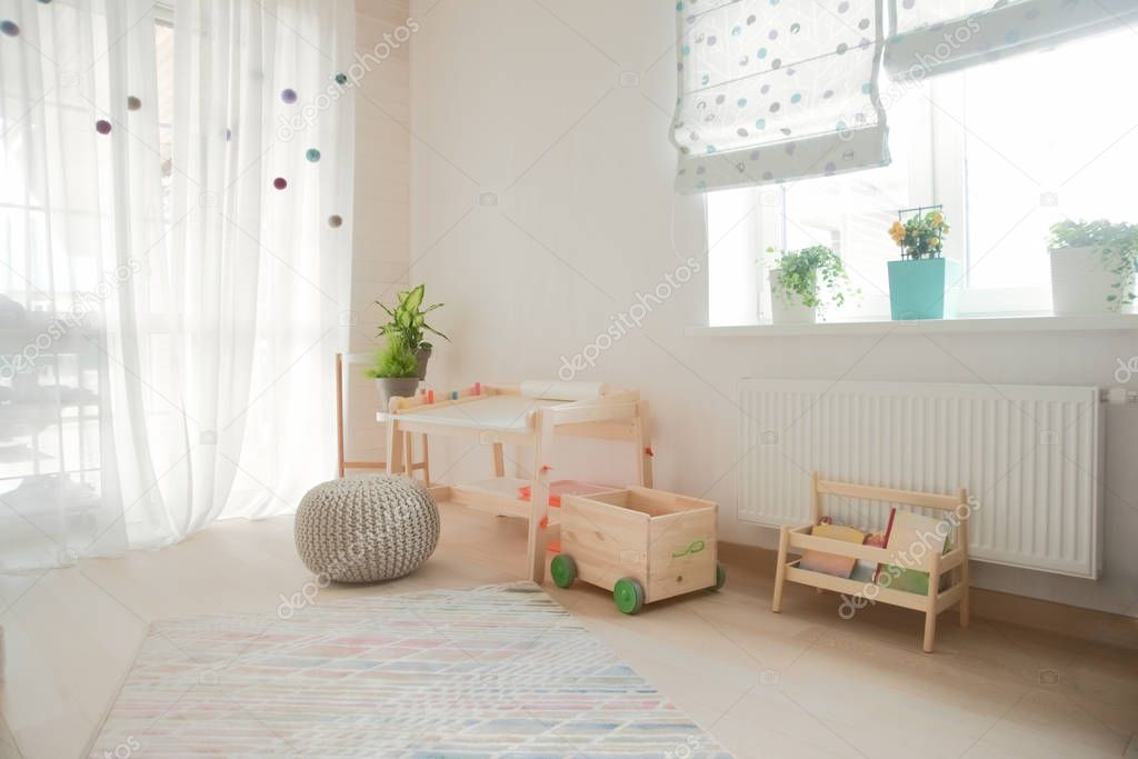 children's room and furniture and natural green flowers 